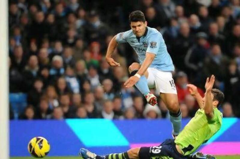 Manchester City's Sergio Aguero scores his sides fourth goal. Peter Powell / EPA