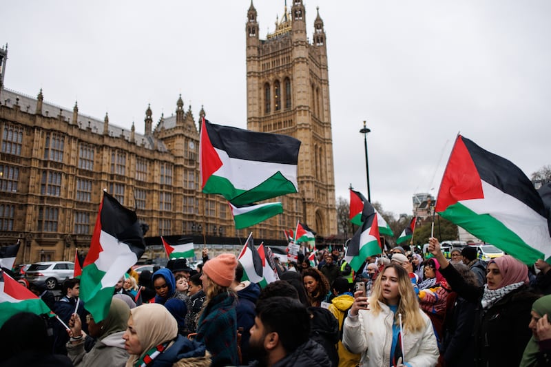Pro-Palestinian protesters queue for the House of Commons public gallery as British MPs debate a motion in Parliament on calling a ceasefire in Gaza. EPA