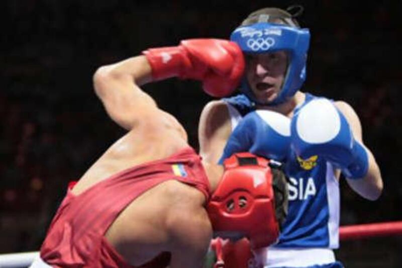 Russia's Albert Selimov (R) fights against Ukraine's Vasyl Lomachenko during their 2008 Olympic Games Featherweight (57 kg) boxing bout on August 11, 2008 in Beijing.