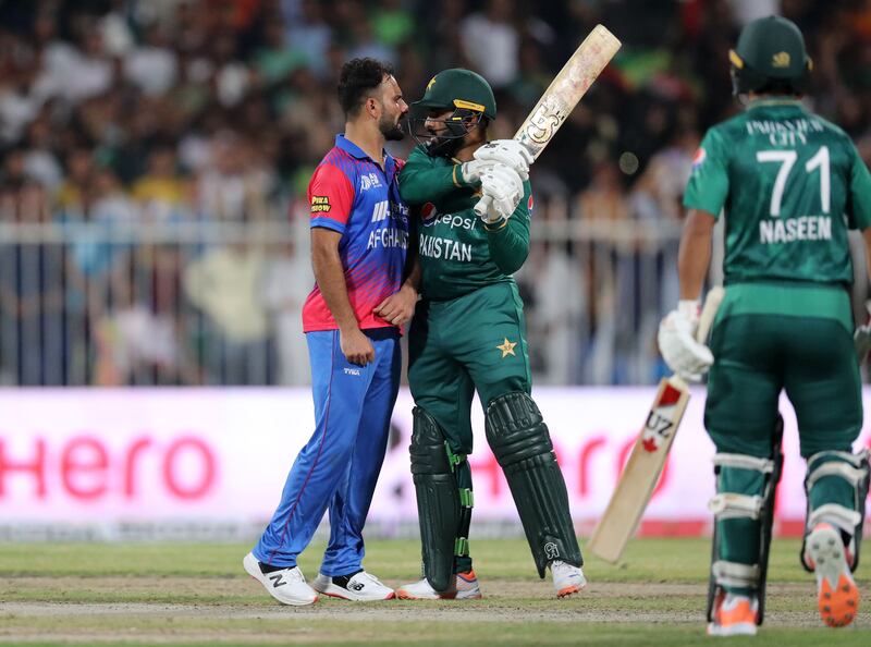 Pakistan's Asif Ali and Afghanistan's Fareed Ahmad square up. 