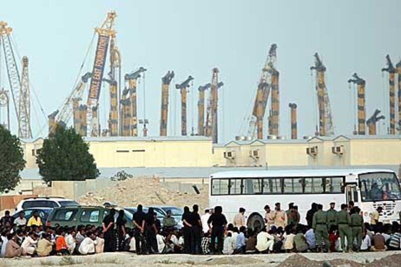 Labourers stage a peaceful protest near Dubai  Investment Park over non-payment of wages.