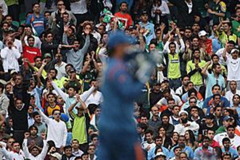 Pakistan and India fans watch their countries face each other during a warm-up for the World Twenty20 at the Oval in London.