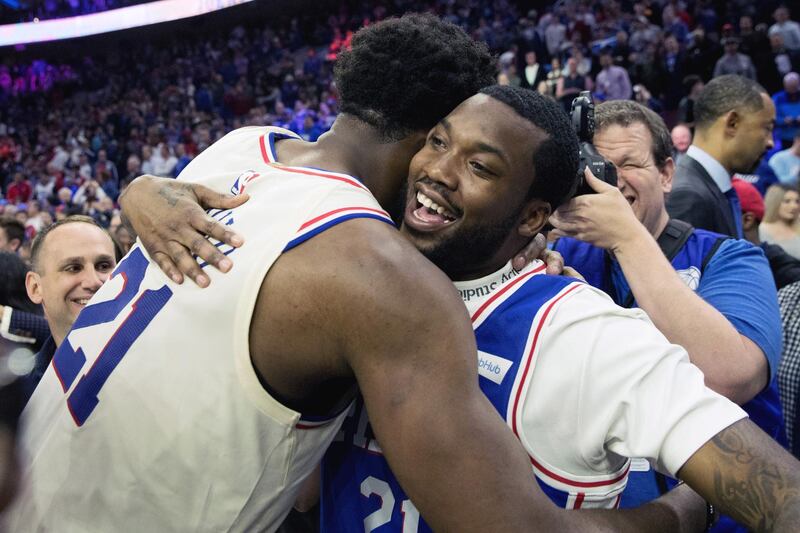 Apr 24, 2018; Philadelphia, PA, USA; Philadelphia 76ers center Joel Embiid (21) hugs recording artist Meek Mill after a victory against the Miami Heat in game five of the first round of the 2018 NBA Playoffs at Wells Fargo Center. Mandatory Credit: Bill Streicher-USA TODAY Sports
