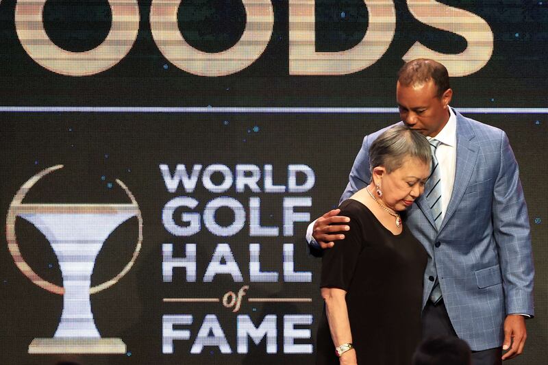 Tiger Woods and his mother Kultida Woods embrace prior to his induction at the 2022 World Golf Hall of Fame. AFP