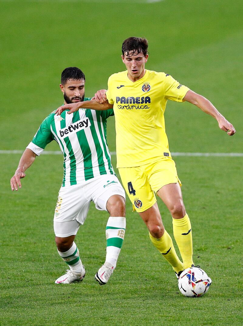 SEVILLE, SPAIN - DECEMBER 13: Pau Torres of Villarreal is challenged by Nabil Fekir of Real Betis during the La Liga Santander match between Real Betis and Villarreal CF at Estadio Benito Villamarin on December 13, 2020 in Seville, Spain. Sporting stadiums around Spain remain under strict restrictions due to the Coronavirus Pandemic as Government social distancing laws prohibit fans inside venues resulting in games being played behind closed doors. (Photo by Fran Santiago/Getty Images)