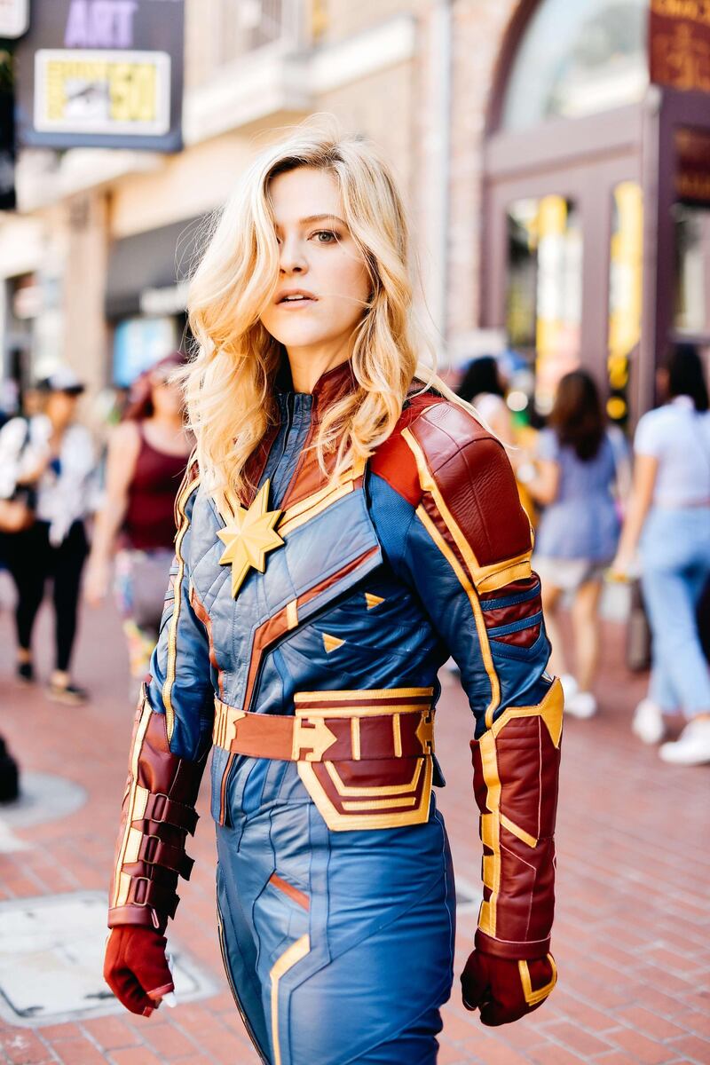 A cosplayer is dressed as Captain Marvel. AFP