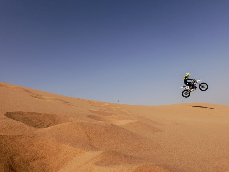 Shannon O'Connor rides his dirt bike during the summer heat in the desert of Dubai. All photos by Reuters