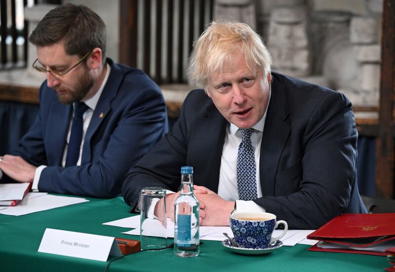 Britain's Prime Minister Boris Johnson with the head of the Civil Service, Simon Case, at a meeting in Stoke on Trent. Getty