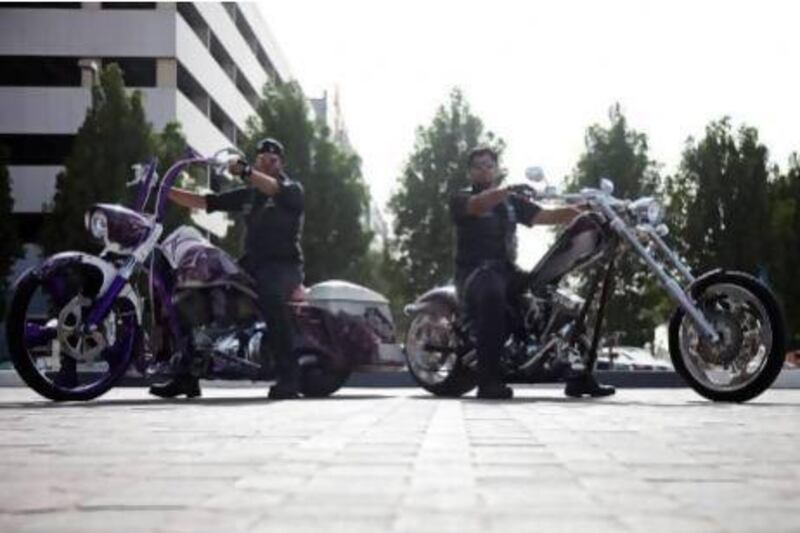 Two members of the Abu Dhabi Falcons, Ismaeil Al Khoori, left, and Ahmed Abudulla Al Masabi, on their modified motorcycles. Lee Hoagland / The National