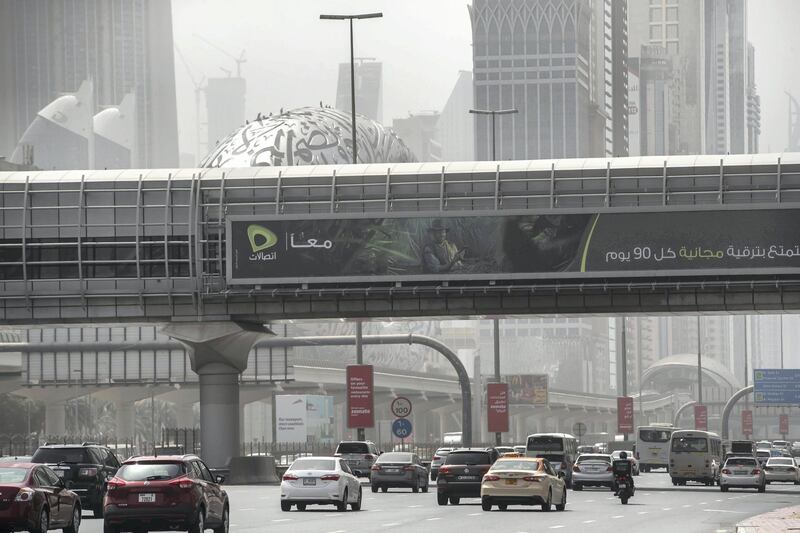 DUBAI, UNITED ARAB EMIRATES. 12 MARCH 2021. Dusty weather with wind in Dubai limits visability. (Photo: Antonie Robertson/The National) Journalist: None. Section: National.