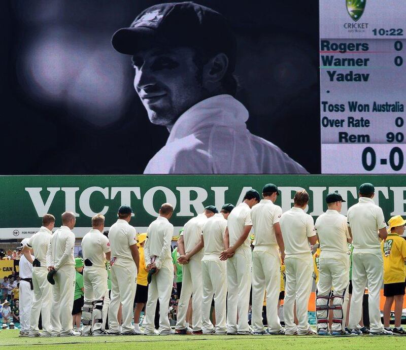 Australia players take a minute's silence to honour Phillip Hughes before the Test match against India in January. William West / AFP