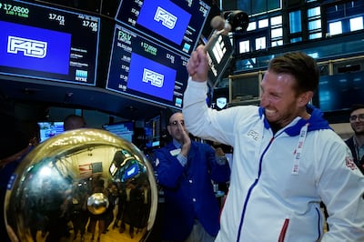F45 Training Holdings CEO and founder Adam Gilchrist rings a ceremonial bell on the New York Stock Exchange trading floor as his company's IPO begins trading. AP