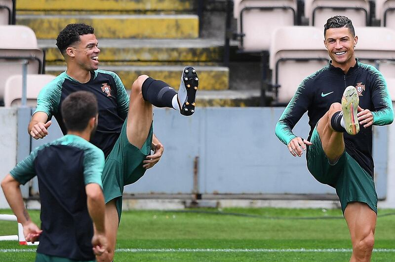 epa07624245 Portuguese players Pepe (back L) and Cristiano Ronaldo (R) warm up during their team's training session at Bessa stadium in Porto, Portugal, 04 June 2019. Portugal will face Switzerland in the UEFA Nations League semi final soccer match on 05 June 2019.  EPA/HUGO DELGADO