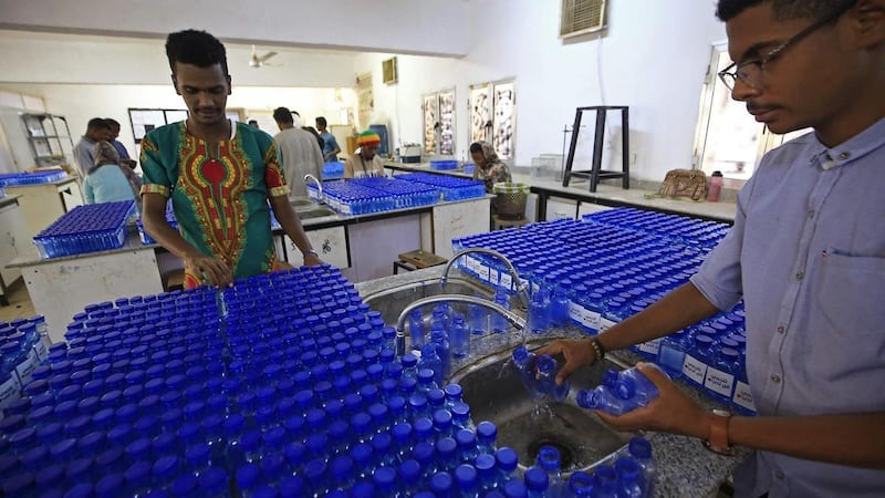 Sudanese medical students prepare sterilisers to help combat the spread of Covid-19. AFP  