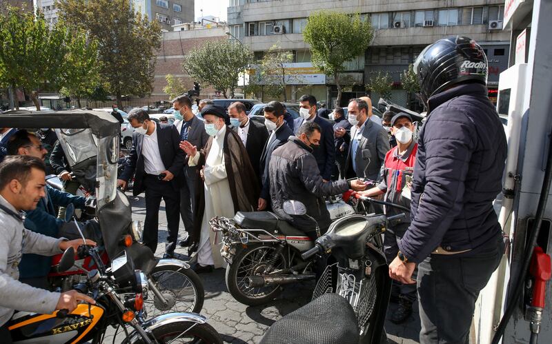 Iranian President Ebrahim Raisi visits a petrol station in Tehran. AFP