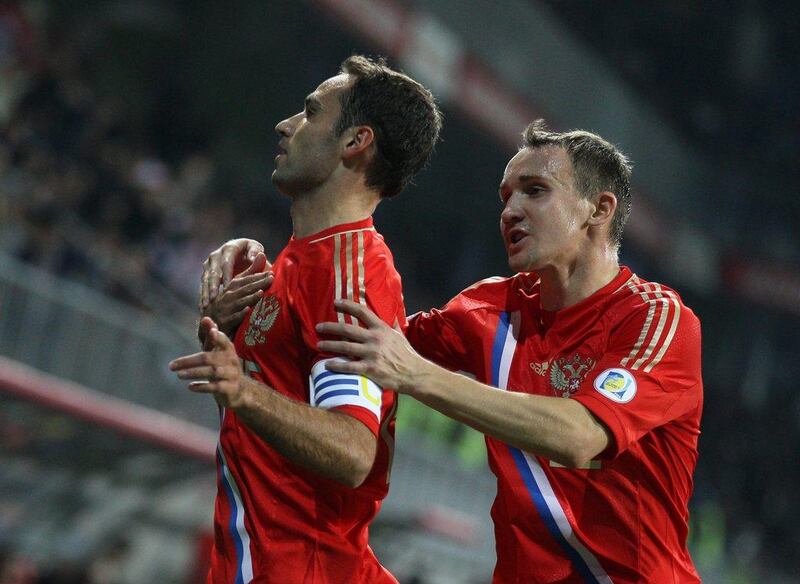 Azerbaijan 1-1 Russia. The Russians needed only a draw in Baku to qualify, and that's what they got thanks to a 16th-minute goal from Roman Shirokov, left. Alexander Mysyakin / AP