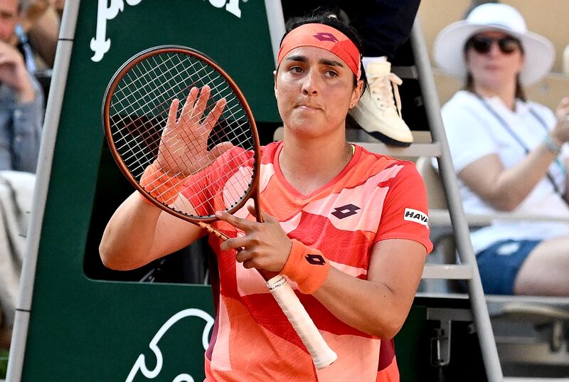 Ons Jabeur of Tunisia applauds the crowd after beating Oceane Dodin at the French Open. EPA