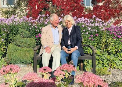 Prince Charles and Camilla shared their Christmas card, which was taken in the garden of their private residence in Scotland. Instagram / Clarence House