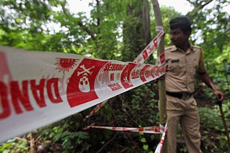 Mumbai police cordon off the crime scene where a photographer was gang-raped by five men last night. Rafiq Maqbool / AP Photo