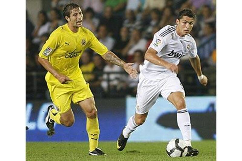 Villarreal's Sebastian Eguren tries to catch up with Real Madrid's Cristiano Ronaldo.