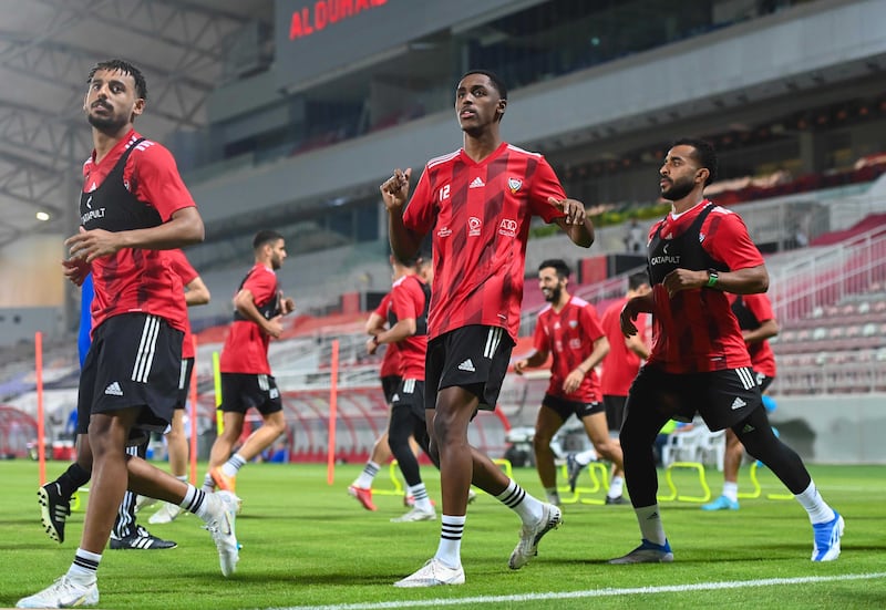 UAE defender Khalifa Al Hammadi (c) trains at the Abdullah bin Khalifa Stadium in Doha ahead of the national team's 2022 World Cup play-off against Australia on Tuesday. Photo: UAE FA