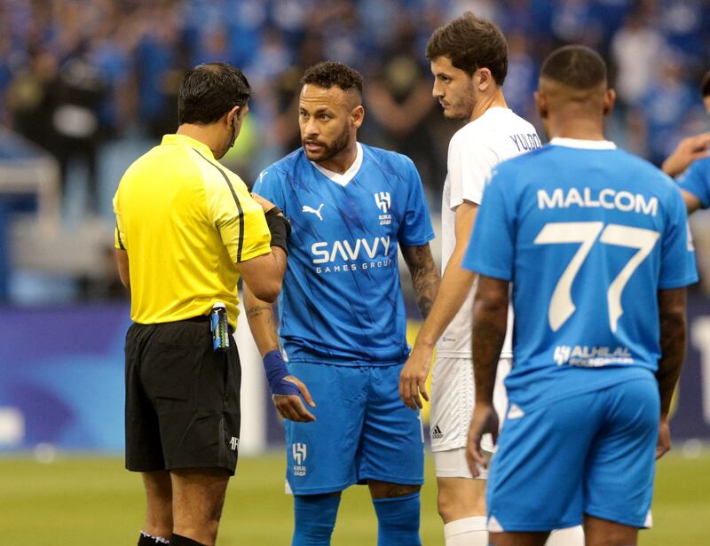 Al Hilal's Neymar remonstrates with referee Mohammed Abdulla Hassan Mohamed. Reuters