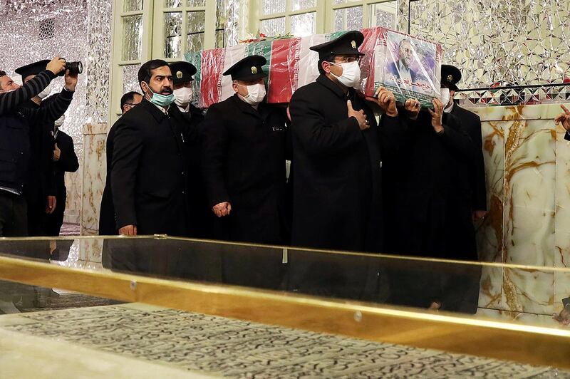Servants of the holy shrine of Imam Reza carry the coffin of Iranian nuclear scientist Mohsen Fakhrizadeh in Mashhad, Iran. WANA via REUTERS