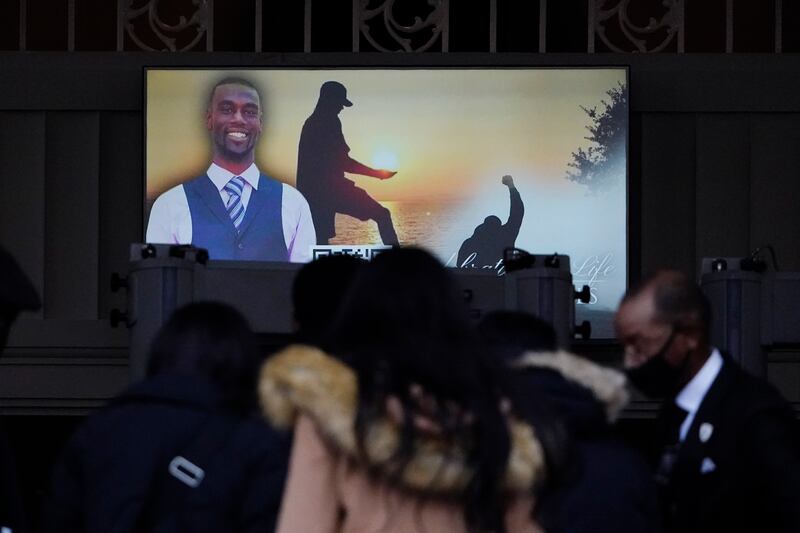 Mourners watch a video celebrating the life of Mr Nichols, who was beaten by Memphis police officers and later died from his injuries. AP