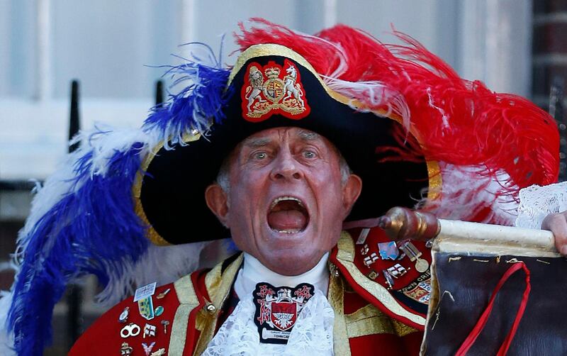 Tony Appleton, a town crier, announces the birth of the royal baby, outside St. Mary's Hospital exclusive Lindo Wing in London, Monday, July 22, 2013. Palace officials say Prince William's wife Kate has given birth to a baby boy. The baby was born at 4:24 p.m. and weighs 8 pounds 6 ounces. The infant will become third in line for the British throne after Prince Charles and William. (AP Photo/Lefteris Pitarakis) *** Local Caption ***  Britain Royal Baby.JPEG-08e8f.jpg