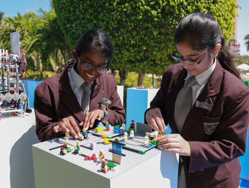 Shravani Mangu, 16, and Nikita Menon, 16, pupils at Gems Our Own English High School in Dubai, have fun with a Lego project at the Global Education and Skills Forum at Atlantis, The Palm. Victor Besa for The National