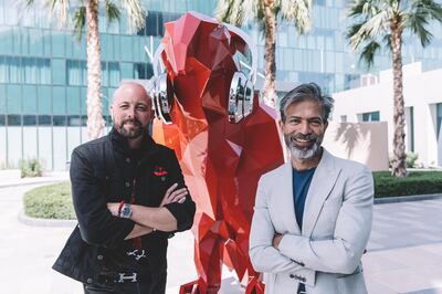 Neel Shukla, the artist behind the falcon sculpture, with Stuart Birkwood, curator at the Radisson Red Dubai Silicon Oasis. 