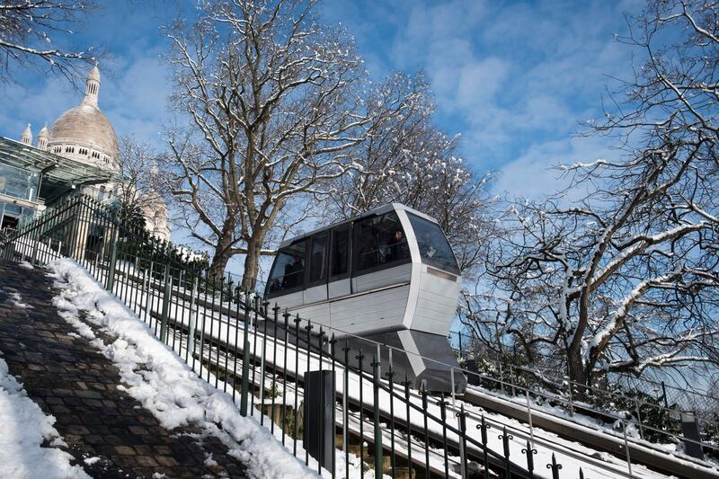 Snow near the funicular of Montmartre below the Sacre-Coeur Basilica in Paris, on February 8, 2018. AFP