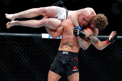 Robbie Lawler picks up Ben Askren in a welterweight mixed martial arts bout at UFC 235, Saturday, March 2, 2019, in Las Vegas. (AP Photo/John Locher)