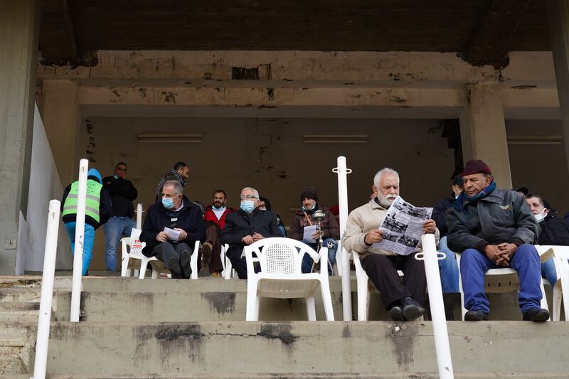 Punters take their seats in the grandstand before a day of racing gets under way.