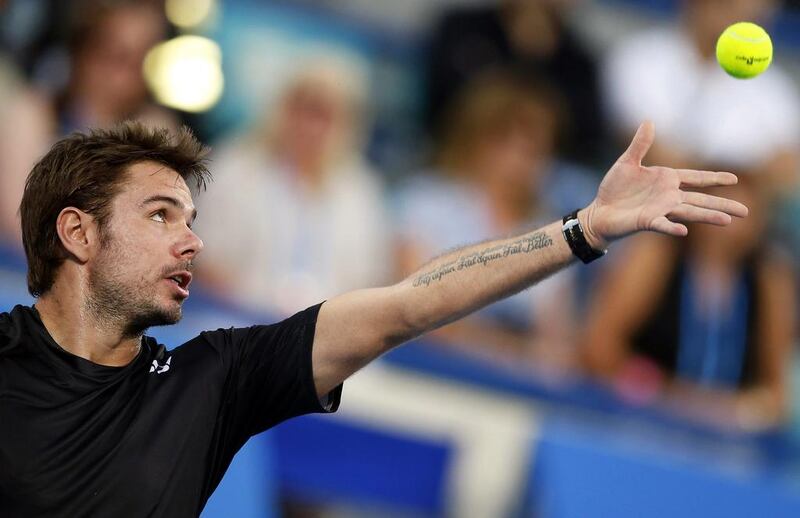 Stan Wawrinka serves to David Ferrer. Ali Haider / EPA