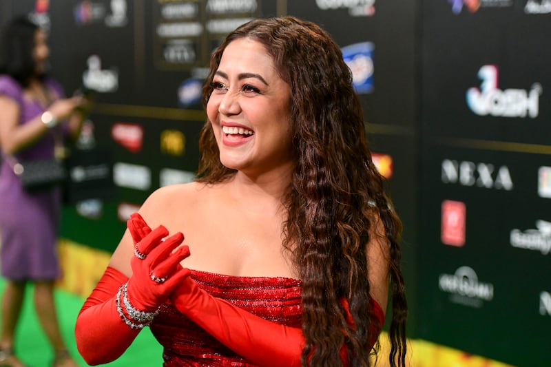 Singer Neha Kakkar walks the green carpet at IIFA Rocks 2022. 