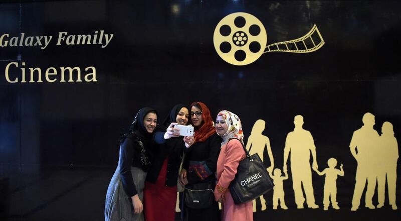 Afghan women take a ‘selfie’ after watching a Hollywood movie at the Galaxy Family Cinema in Kabul in November 2016. Shah Marai / AFP Photo 