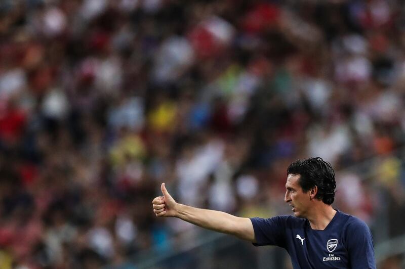 Arsenal's manager Unai Emery gestures during the International Champions Cup match between Arsenal and Paris Saint-Germain in Singapore, Saturday, July 28, 2018. (AP Photo/Yong Teck Lim)