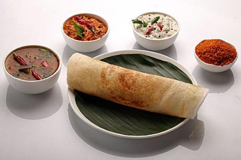 Dosa served with sambar and various chutneys. The portion at Aryaas is easily enough to do for lunch.