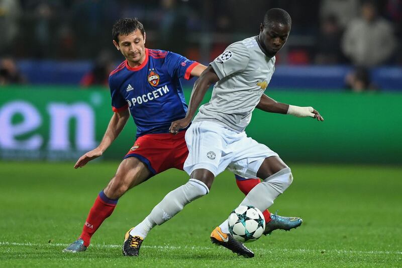 CSKA Moscow's midfielder from Russia Alan Dzagoev (L) and Manchester United's defender from Ivory Coast Eric Bailly vie for the ball during the UEFA Champions League Group A football match between PFC CSKA Moscow and Manchester United FC in Moscow on September 27, 2017. / AFP PHOTO / Yuri KADOBNOV