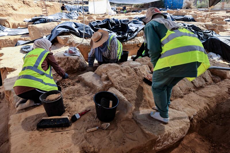 A team of archaeologists at the site of a cemetery dating from the Roman era that was discovered in Jebaliya in the northern Gaza Strip last year. AFP
