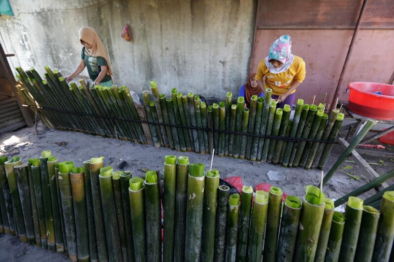 Women prepare Lemang - a favourite Acehnese food for breaking fast.  EPA