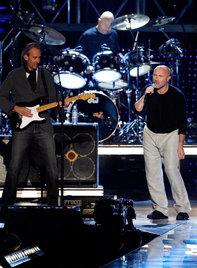 Genesis members Mike Rutherford, Chester Thompson and Phil Collins perform at VH1 Rock Honors ceremony in 2007. Getty Images
