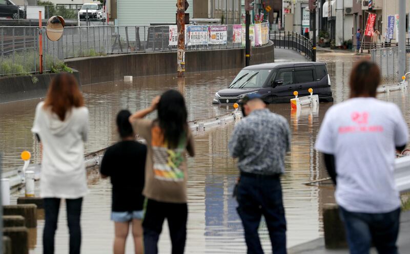 A road is flooded by heavy train in Higashihiroshima, Hiroshima Prefecture, Japan. EPA