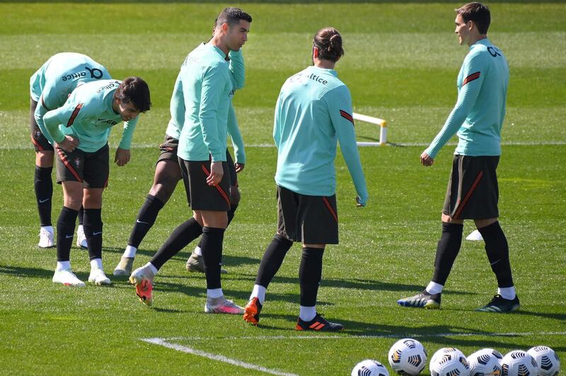 Cristiano Ronaldo, centre, during a training session in Italy, ahead of their upcoming 2022 World Cup qualifier against Azerbaijan. AFP