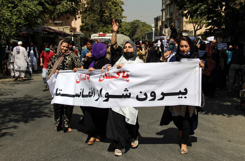 Afghans hold placards shouting anti-Pakistan slogans during a protest in Kabul, Afghanistan, on September 7, 2021. EPA