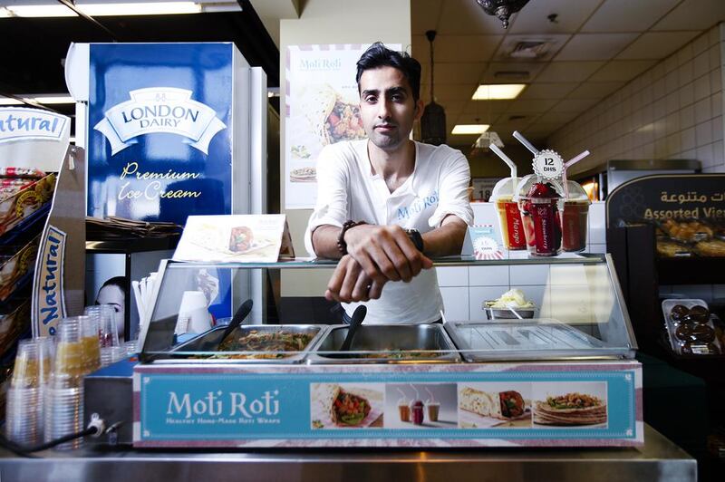 Tahir Shah, owner of Moti Roti, at one of his pop-ups in the Aswaaq supermarket, Knowledge Village, Dubai. Mr Shah says mobile kiosks and food trucks can greatly reduce overheads. Sarah Dea / The National