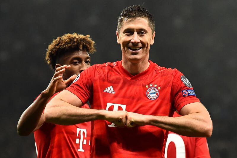 Bayern Munich forward Robert Lewandowski celebrates after scoring their second goal. AFP