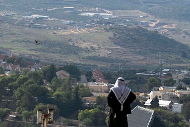 A Palestinian man looks towards the Israeli settlement of Shavei Shomron, built next to the Palestinian village of Naqoura, north-west of Nablus, in the occupied West Bank. AFP