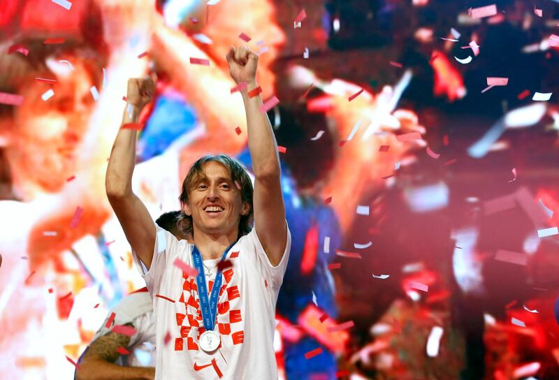 Croatia's player Luka Modric celebrates upon arrival in Zagreb, Croatia, Monday, July 16, 2018. Euphoria gave way to a mixture of disappointment and pride for Croatia fans after their national team lost to France in its first ever World Cup final. (AP Photo/Darko Vojinovic)